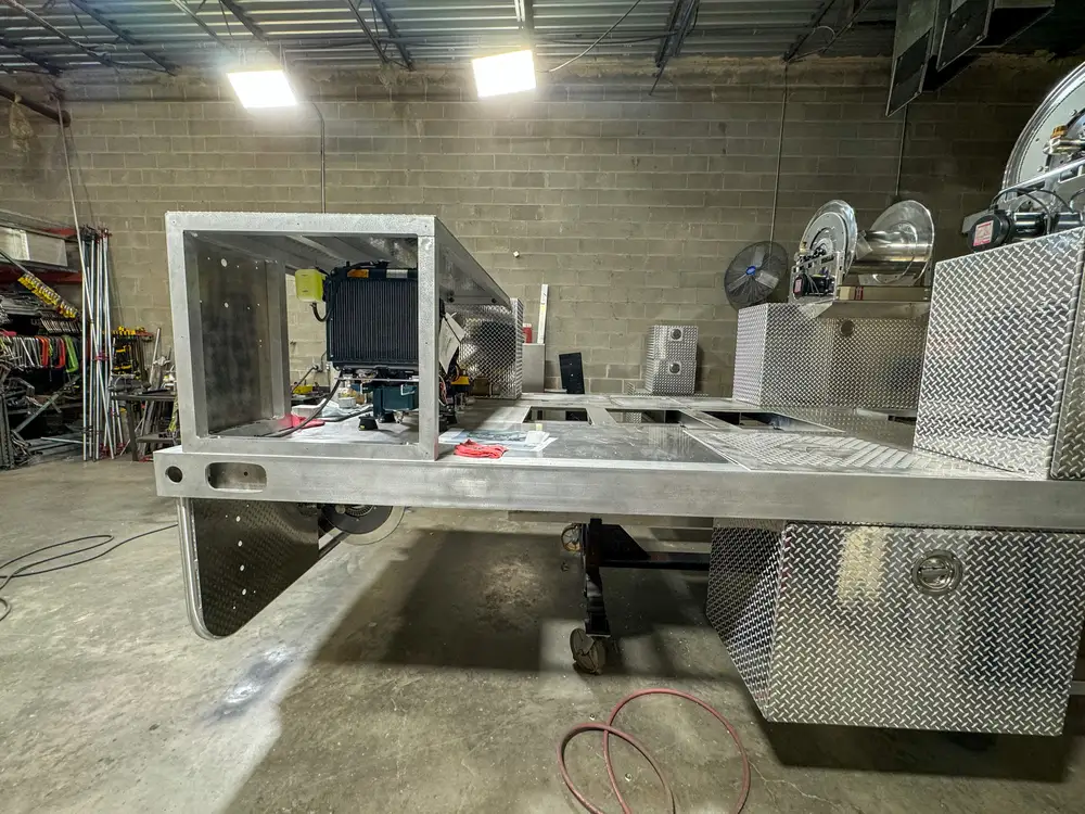 Pump and plumbing components during installation, photo 173 of 303.